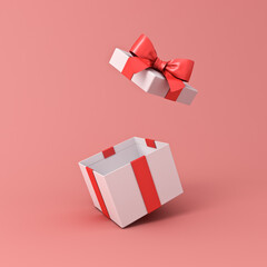 Blank open white gift box or present box with red ribbon bow isolated on light red pink orange...