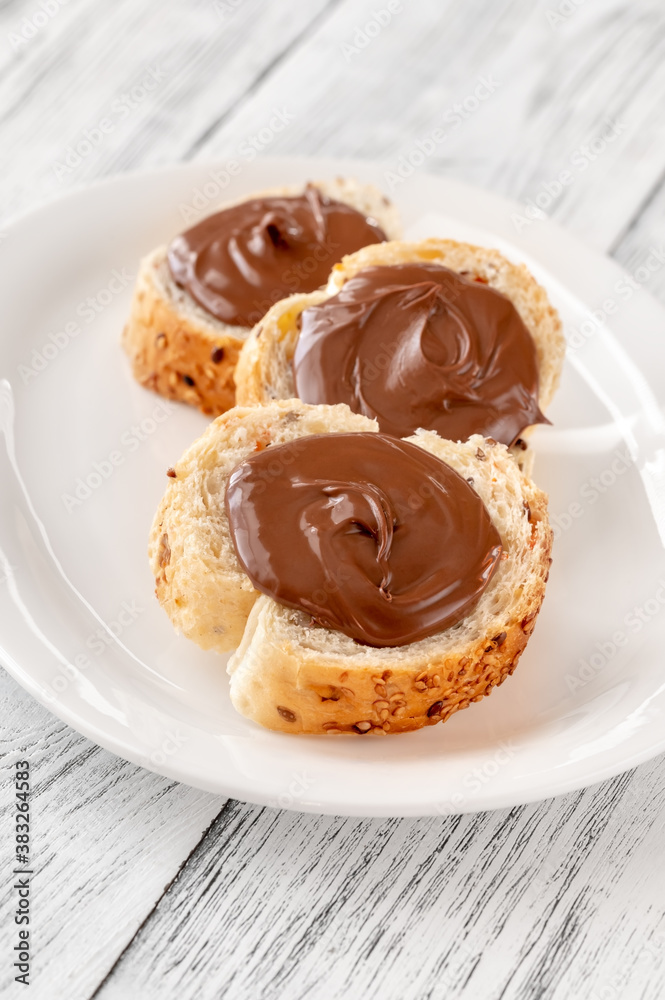 Wall mural Slices of baguette with chocolate paste