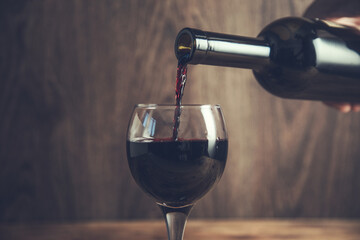 pouring grape wine into a glass