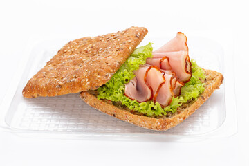 Sandwich with ham sausage on white background.