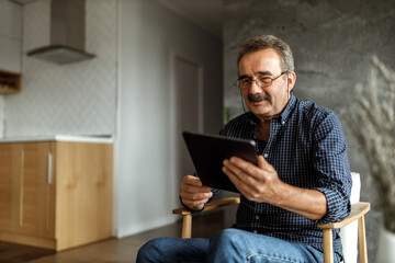 Man using modern technology, happy face.