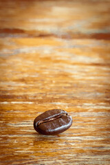 A roasted Arabica coffee bean  on wooden  floor