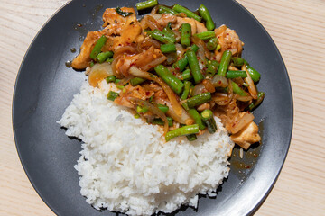 Chilli chicken and bean stir fry with rice.