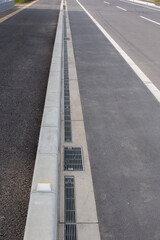 Fototapeta premium a curb sandwiched between the sidewalk and the driveway