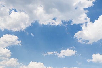 Obraz na płótnie Canvas Beautiful white fluffy clouds on a blue sky background