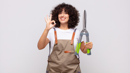 arab pretty woman gardener with a pruning shears