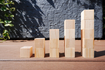 step up and growth image, wooden blocks with outdoor background, ステップアップ、成長イメージの積木、木材ブロックの階段