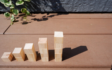 step up and growth image, wooden blocks with out door background, ステップアップ、成長イメージの積木、木材ブロックの階段