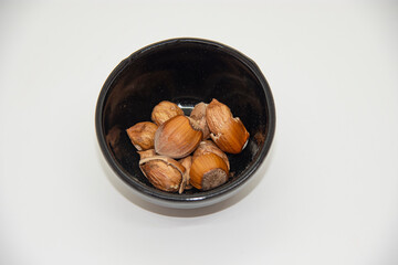 fresh hazelnuts cracked in bowl