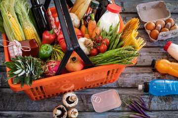 Shopping basket filled with foods from supermarket