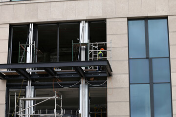 scaffolding near the building and a worker