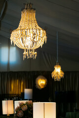 Suspended chandelier as interior decor at corporate gala dinner