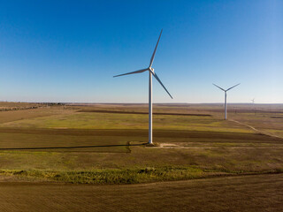 windmills work in a summer field