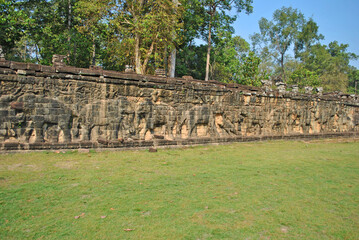 Fototapeta na wymiar Ancient bas-reliefs at the Terrace of the Elephants in Angkor Thom
