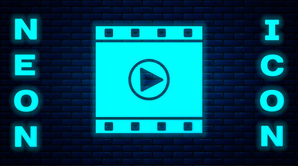 Glowing neon Play Video icon isolated on brick wall background. Film strip sign. Vector Illustration.