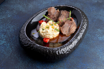 Chopped meat and mashed potatoes in a plate