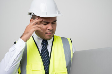 Young asian civil engineer helmet hard hat standing and headache hands in head feeling depressed on isolated white background. Mechanic service concept.