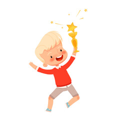 Little cute boy jumps and rejoices with a golden cup in his hands. Children's competition victory. Child winner