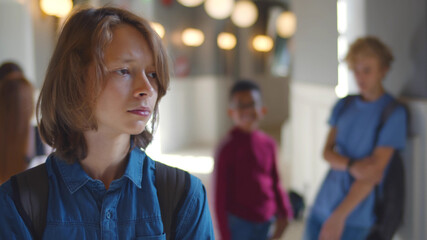 School children bullying and offending upset teen boy © nimito