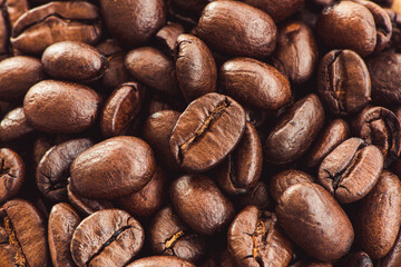 Roasted coffee beans background, close up