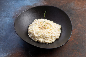 traditional Italian risotto in a dark plate