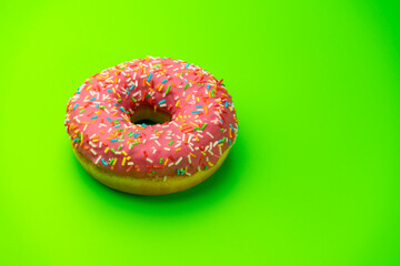 donut donuts on a green background close-up. isolate