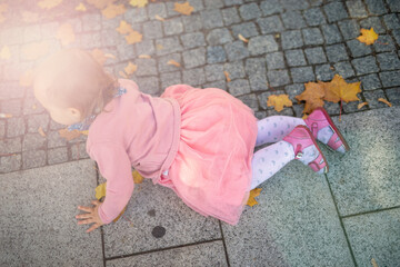 Naklejka premium Little girl spending fantastic time on playground. Happy childhood. Authentic image.