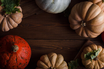 Wooden background with pumpkins for writing. Halloween background. Autumn background