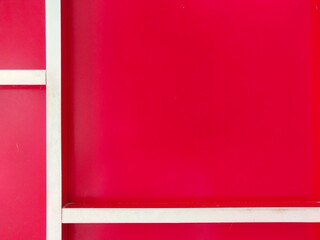 The image of the back of the cabinet in white and red contrasting
