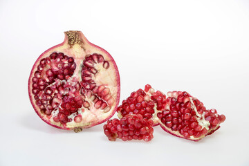 fresh and delicious pomegranate isolated on white background
