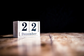 December 22nd, 22 December, Twenty Second of December - White block calendar on vintage table - Date on dark background