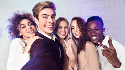 Millennial People Making Selfie Having Fun On Corporate Party Indoors