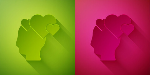 Paper cut Human head with heart icon isolated on green and pink background. Love concept with human head. Paper art style. Vector.