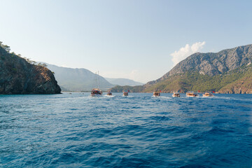 Adrasan, Antalya/Turkey-September 25 2020: Tour boats carrying tourists travel in the Mediterranean as a group.