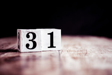 Number 31 isolated on dark background- 3D number thirty one isolated on vintage wooden table