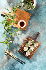 Unusual composition of rolls. A portion of rolls with an unusual filling. Top view of sushi.