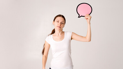 woman holding blank speech bubble on white background