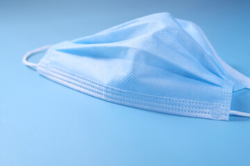 Close up of blue surgical masks on table 