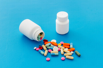 Pills bottle with medicines and vitamins, close up