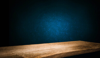 background reflection from a window on the wall, and a worn old wooden table