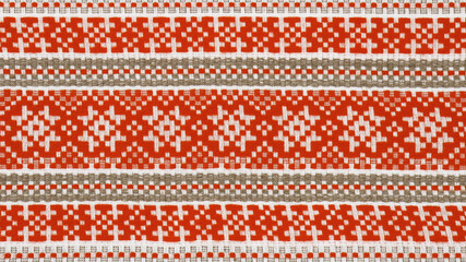Textile texture in red, brown and white colors. Belarus ornament