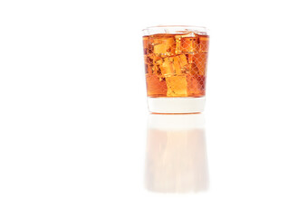 Glass of peached iced tea isolated on interesting background