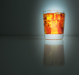 Iced tea served in a glass isolated on dark background