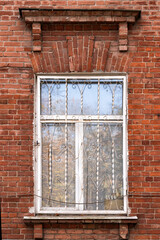 Framed window old red brick building