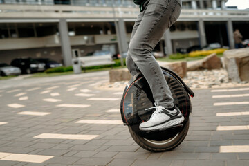 Man riding unicycle on street © bortnikau