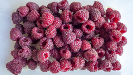a bunch of ripe raspberries