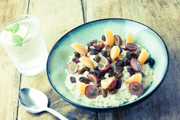 Oatmeal, seasonal fruit and glass of water