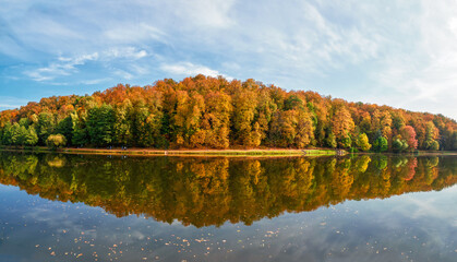 Panorama of the autumn Park. Beautiful autumn landscape with red trees by the lake. Tsaritsyno, Moscow