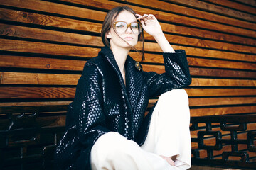 Portrait of beautiful dark-haired Young woman in eyeglasses