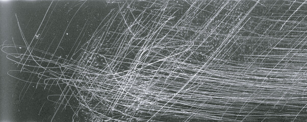 Noisy film frame with heavy scratches, dust and grain